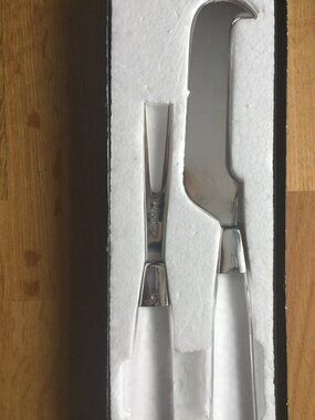 Vintage in box cheese knife and fork set made in Japan with clear handles